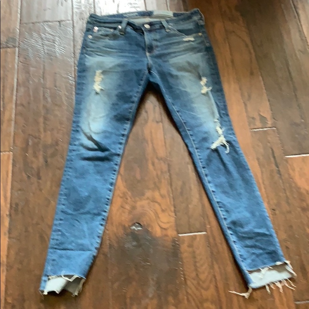 AG stretch denim jean with high low frayed hem